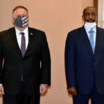 US Secretary of State Mike Pompeo (L) poses for a picture with Sudan's Sovereign Council chief General Abdel Fattah al-Burhan in Khartoum on August 25, 2020. - Pompeo is on an official visit to Sudan to urge more Arab countries to normalise ties with Israel, following the US-brokered Israel-UAE agreement. He is the first American top diplomat to visit Sudan since Condoleezza Rice went in 2005. (Photo by - / AFP)